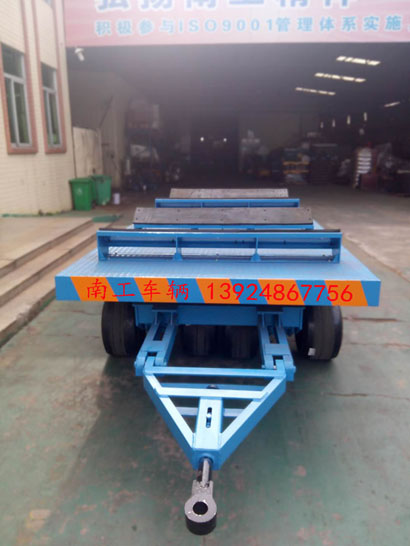 1676945644369315.jpg 30吨重型铁皮卷圆桶专用平板车1I.jpg